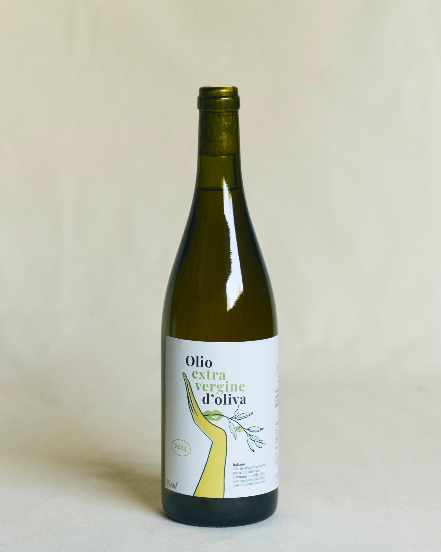 Bottle of olive oil with a label design on a plain background